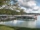 Bridge marina on norris lake with boats docked on cloudy day