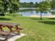 Norris lake water front park with picnic bench on sunny day
