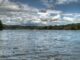 View of watts bar lake in east tennessee on cloudy day with boat in the distance on waves